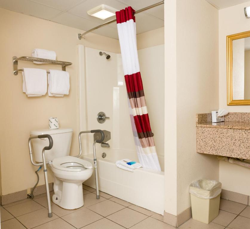 a bathroom with a toilet and a shower at Red Roof Inn & Suites Pigeon Forge Parkway in Pigeon Forge