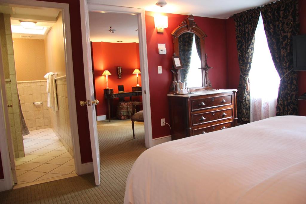 Postel nebo postele na pokoji v ubytování Morris House Hotel