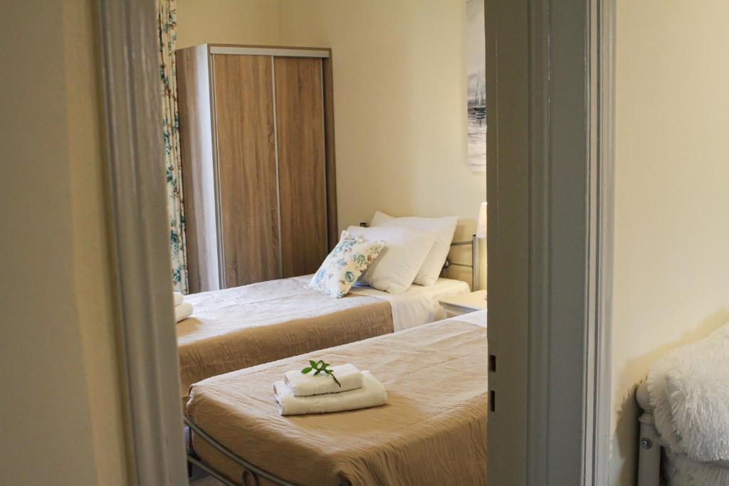 Postel nebo postele na pokoji v ubytování Navigator Villas - Houses