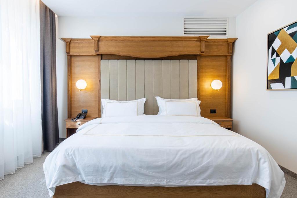 Postel nebo postele na pokoji v ubytování Hotel Afa