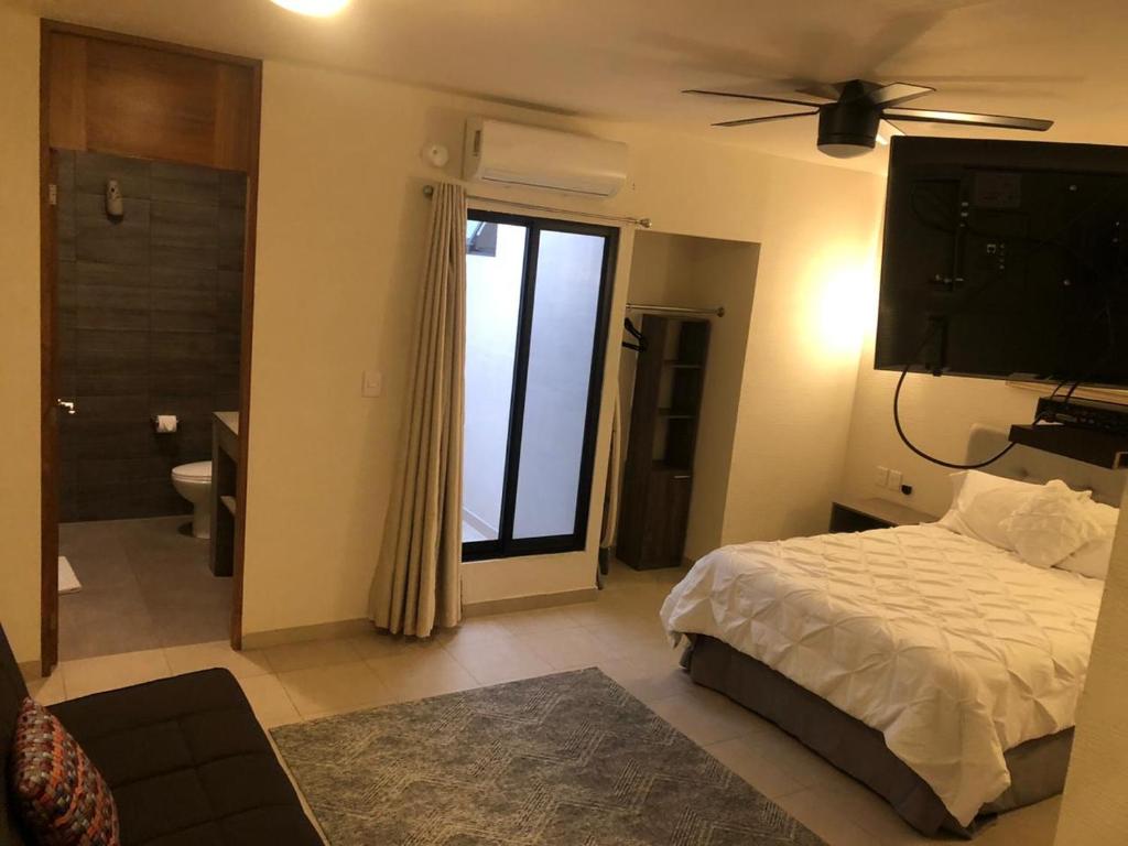 Postel nebo postele na pokoji v ubytování Hotel Siena