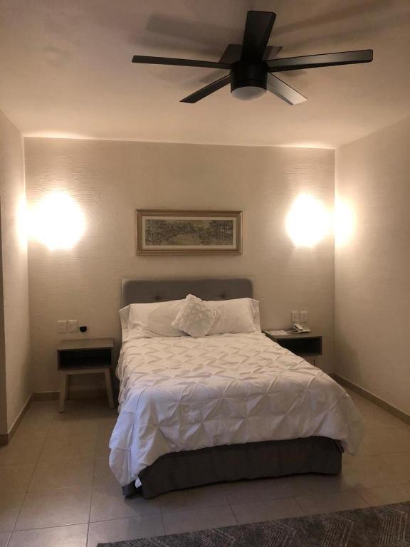 Postel nebo postele na pokoji v ubytování Hotel Siena