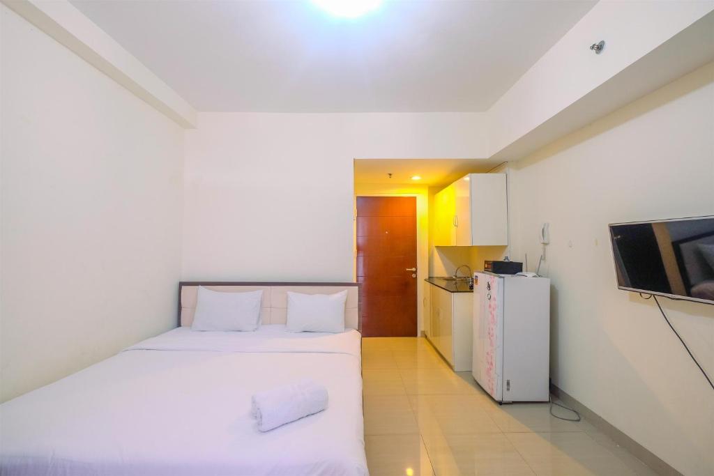 Cozy Living Studio Apartment Taman Melati Margonda near Universitas Indonesia By Travelio - Housity