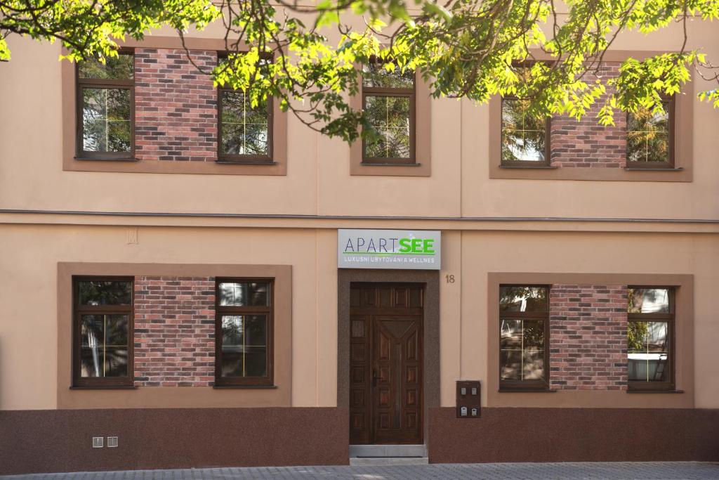 a building with a sign that reads april sale at Apartsee Wellness Plzeň in Plzeň