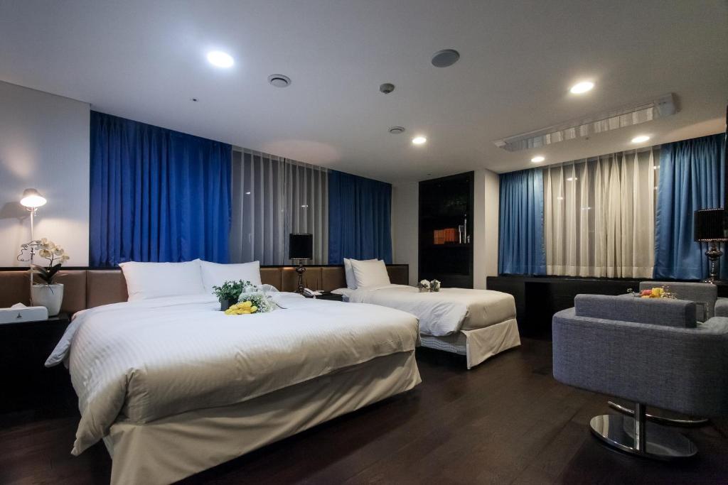 Postel nebo postele na pokoji v ubytování Hotel Pharos