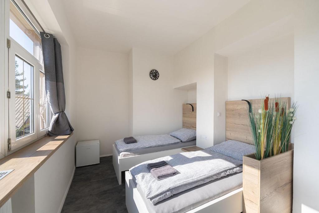 Postel nebo postele na pokoji v ubytování Apartsee Wellness Plzeň