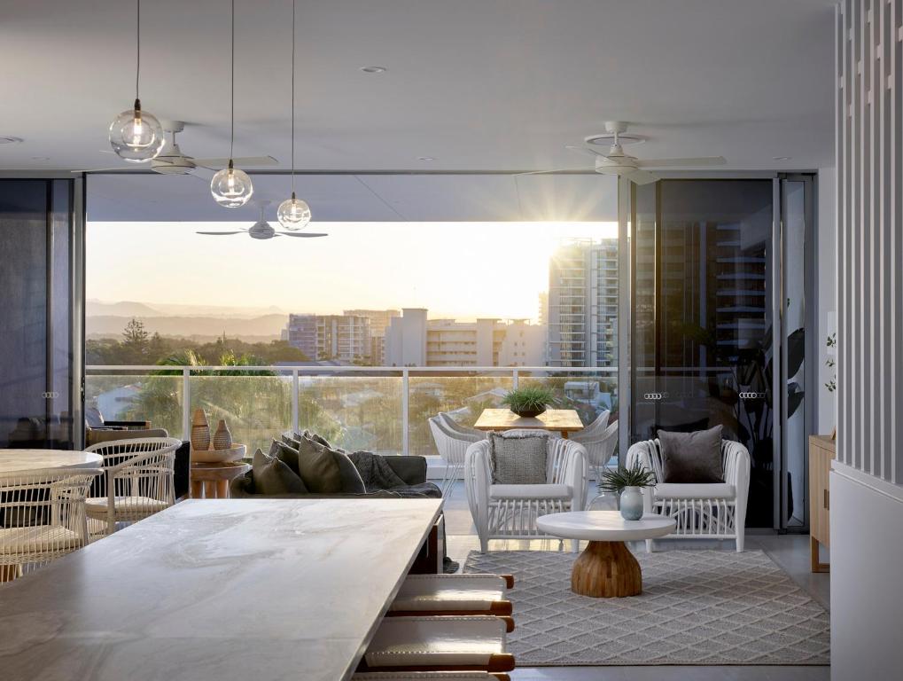 a living room with a view of a city at The Beach Houses Holiday Villas in Gold Coast