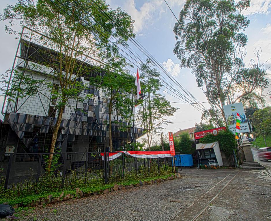 a building with a fence in front of it at DJourney Hotel Lembang by Escotel in Bandung