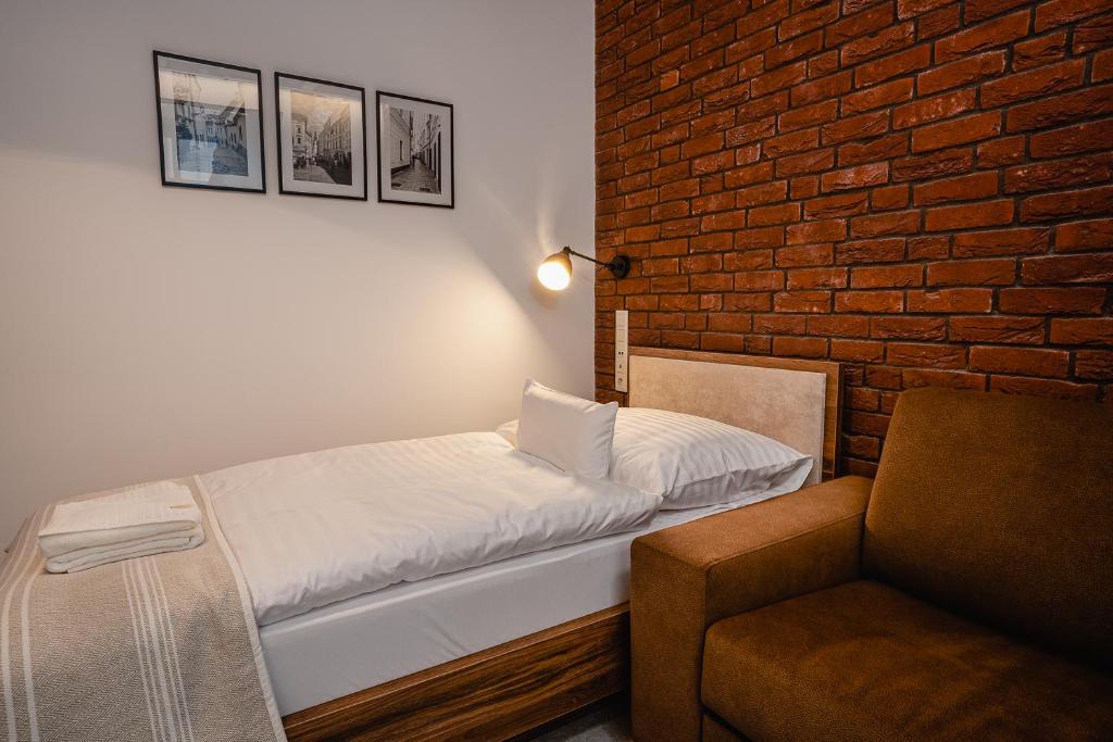 Postel nebo postele na pokoji v ubytování Garni Hotel DOCK Bratislava