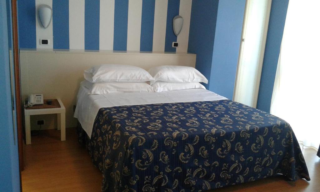 Łóżko lub łóżka w pokoju w obiekcie Hotel La Palazzina