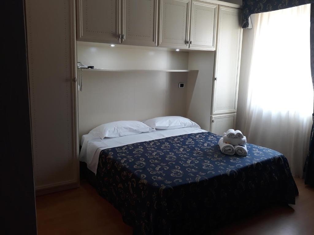 Łóżko lub łóżka w pokoju w obiekcie Hotel La Palazzina