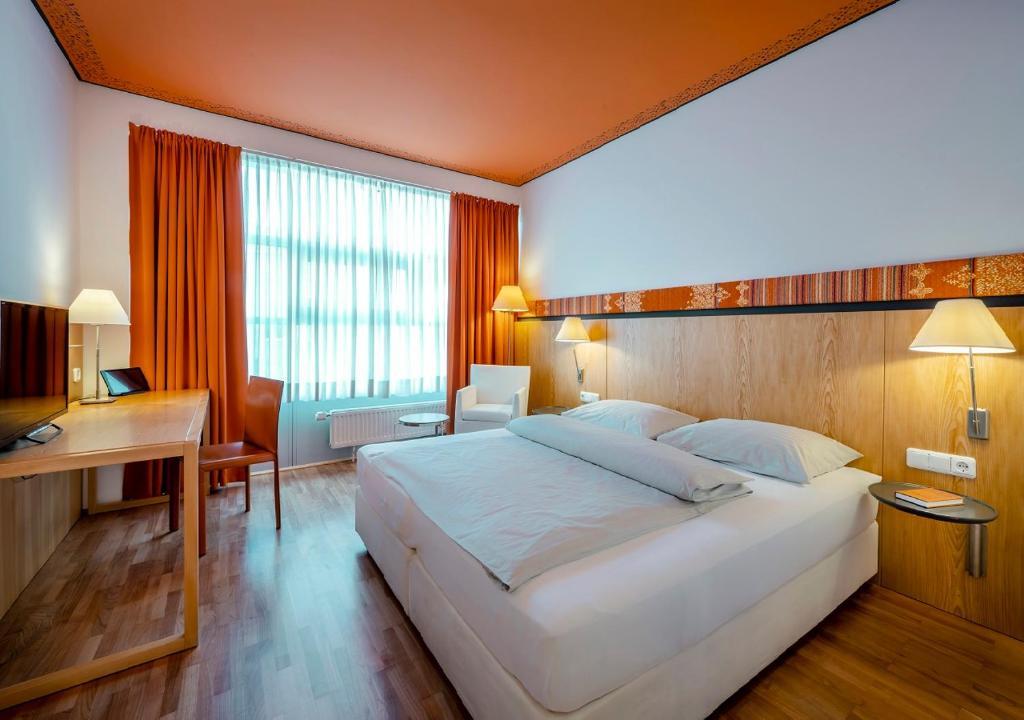 Postel nebo postele na pokoji v ubytování Boutique Hotel Hauser