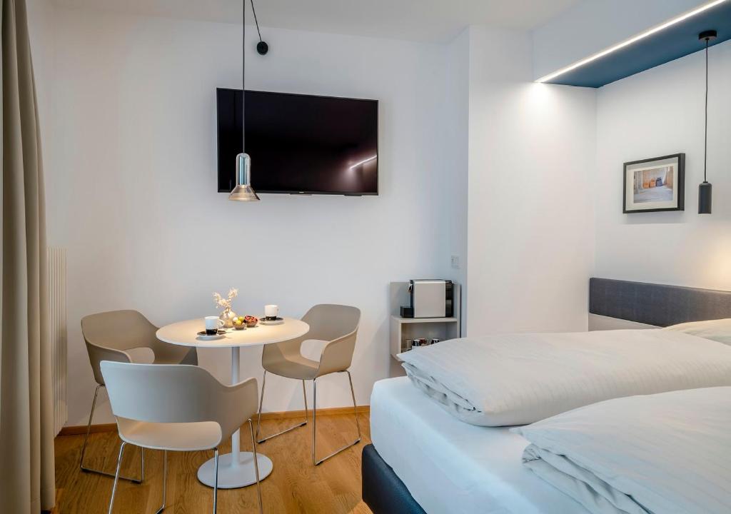 Postel nebo postele na pokoji v ubytování Boutique Hotel Hauser