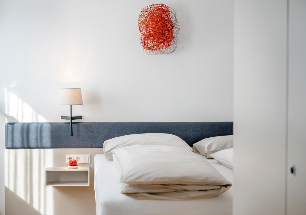 Postel nebo postele na pokoji v ubytování Boutique Hotel Hauser