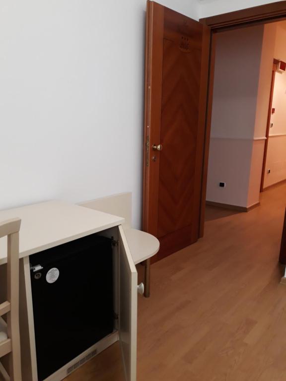 Telewizja i/lub zestaw kina domowego w obiekcie Hotel La Palazzina