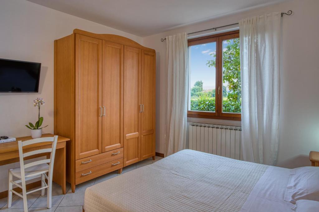 Postel nebo postele na pokoji v ubytování Villa Camporosso