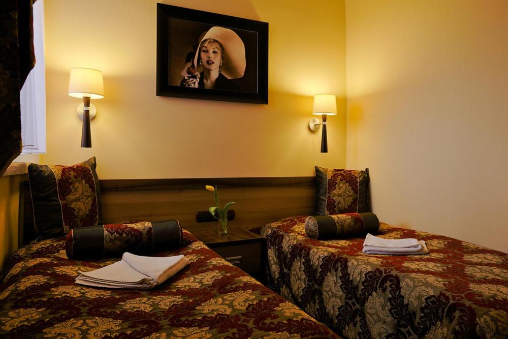 Postel nebo postele na pokoji v ubytování Hotel Politański