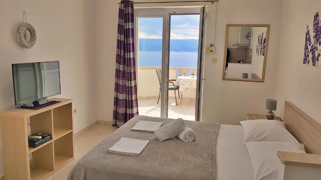Postel nebo postele na pokoji v ubytování Apartments Nemira