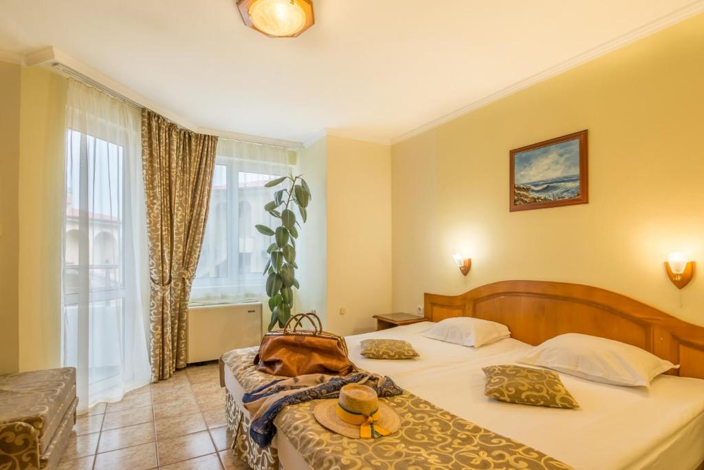 Postel nebo postele na pokoji v ubytování Hotel Villa List
