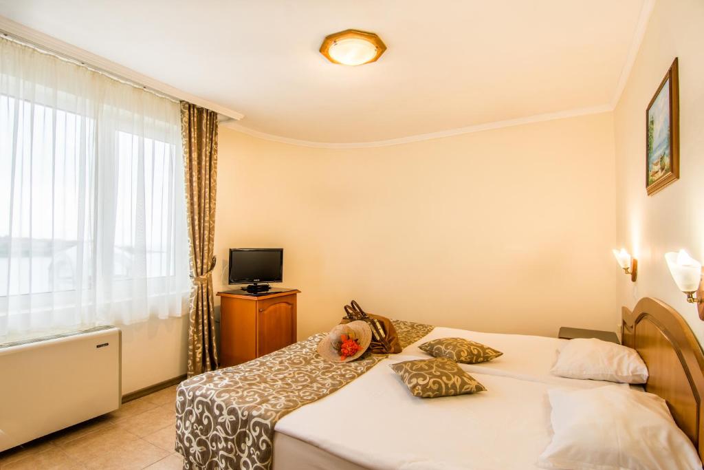 Postel nebo postele na pokoji v ubytování Hotel Villa List