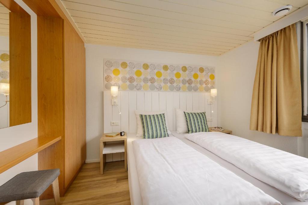 Postel nebo postele na pokoji v ubytování Center Parcs De Eemhof