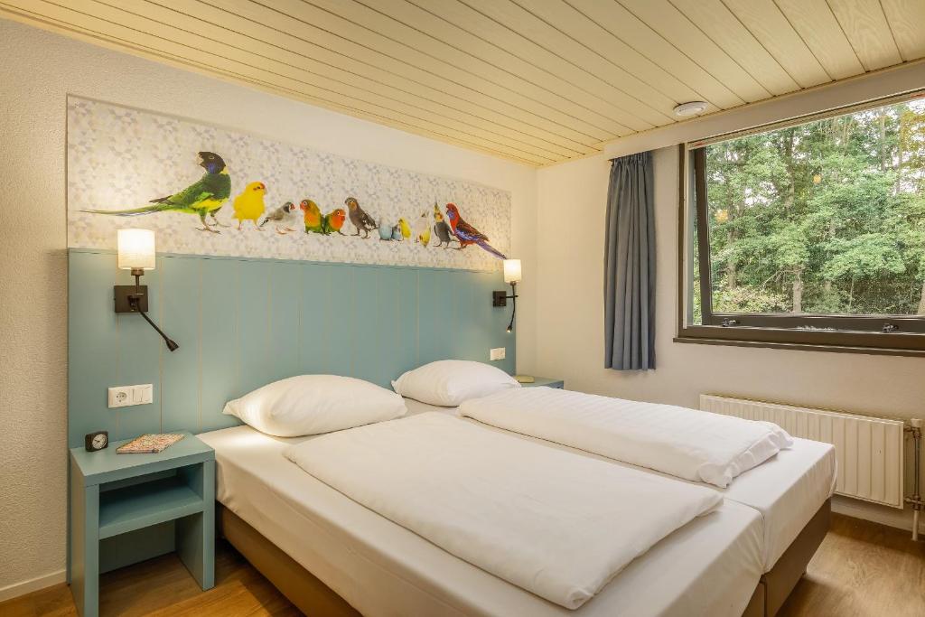 Postel nebo postele na pokoji v ubytování Center Parcs De Eemhof