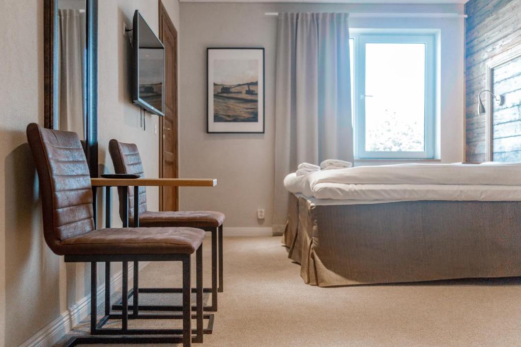 Postel nebo postele na pokoji v ubytování Lydinge Resort
