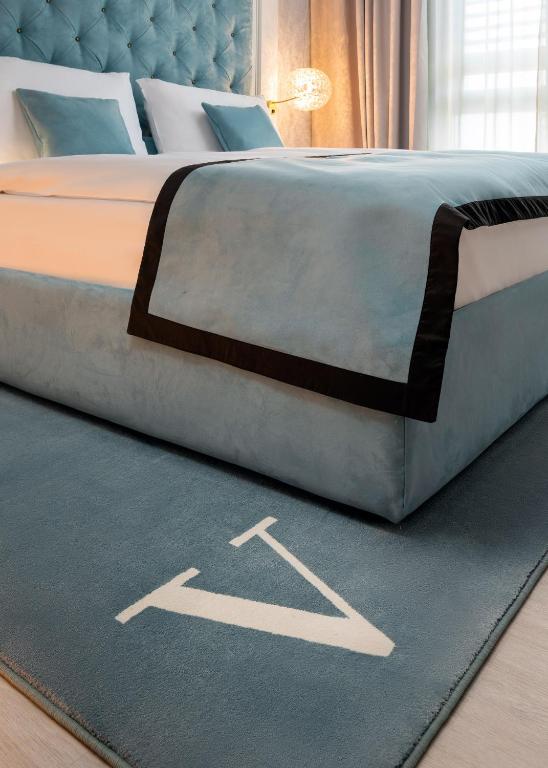 Postel nebo postele na pokoji v ubytování Hotel Vatel 4* Superior