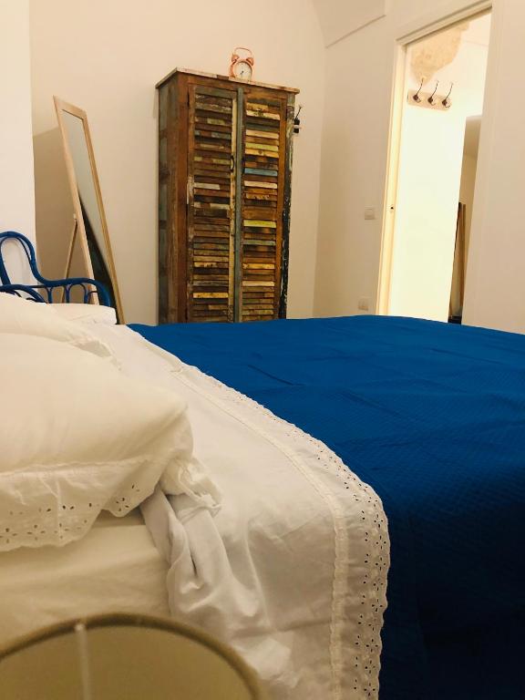 Postel nebo postele na pokoji v ubytování Zì Marì - Via Sirene