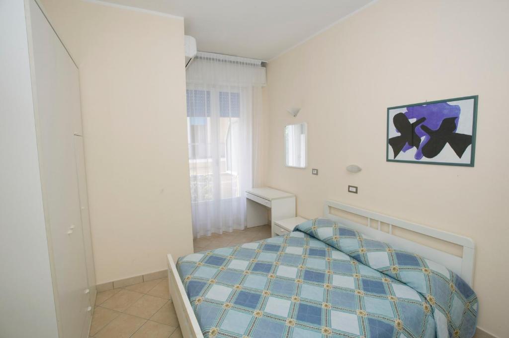 Postel nebo postele na pokoji v ubytování Hotel Maré - Valentini Family Village