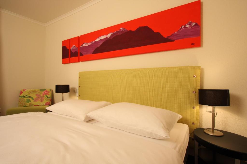 Ένα ή περισσότερα κρεβάτια σε δωμάτιο στο Seehotel Gotthard