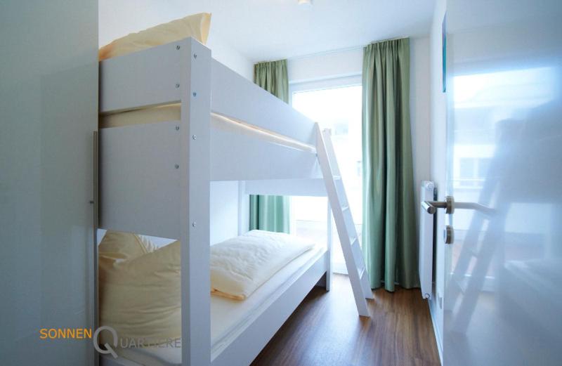 Voodi või voodid majutusasutuse Apartments Boardinghaus Norderney toas