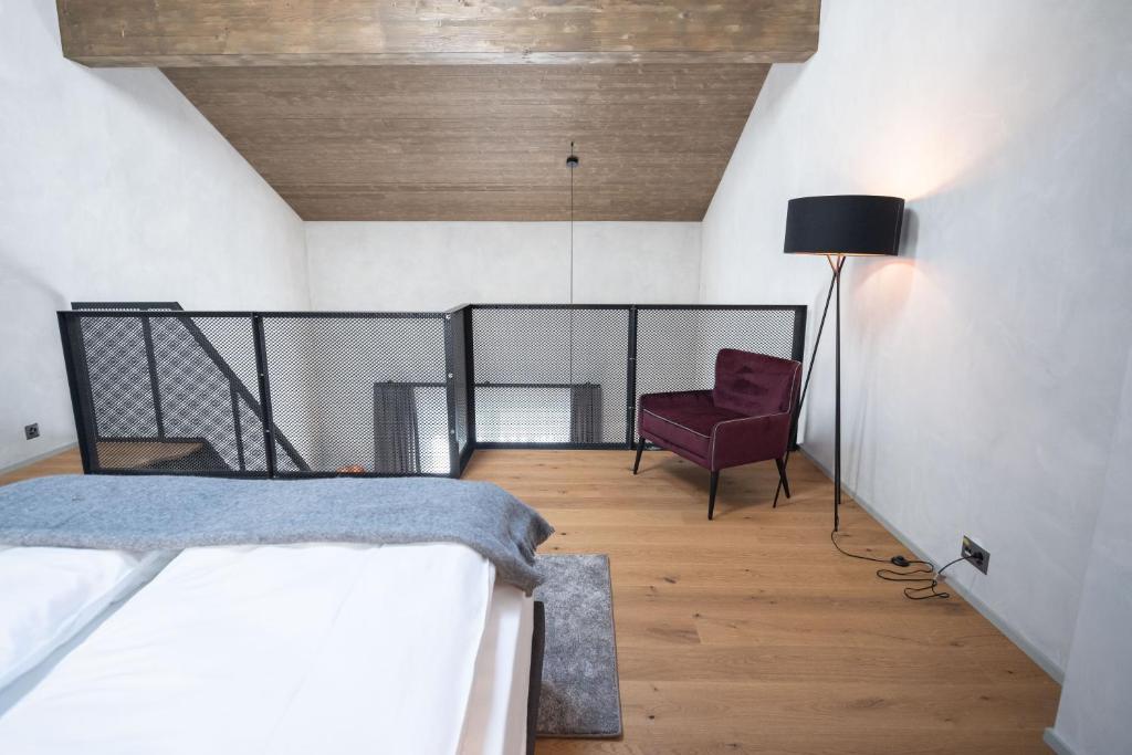 Postel nebo postele na pokoji v ubytování Andermatt Alpine Apartments