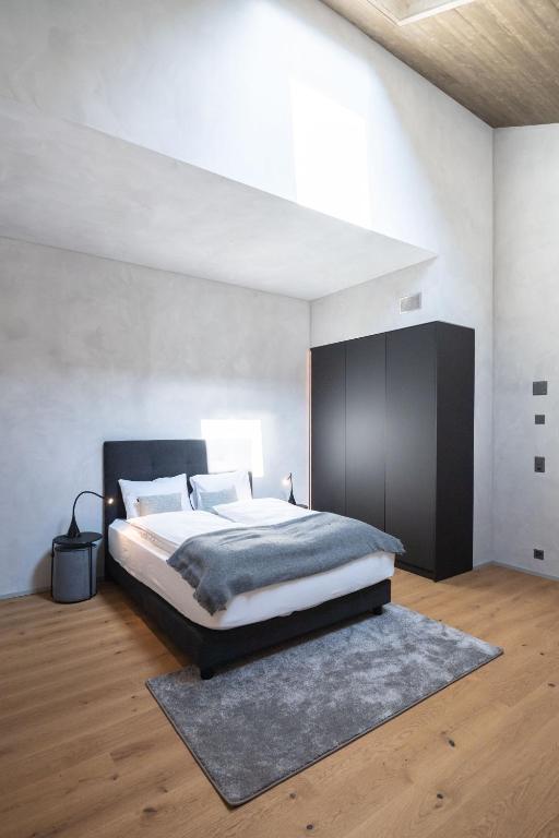 Postel nebo postele na pokoji v ubytování Andermatt Alpine Apartments