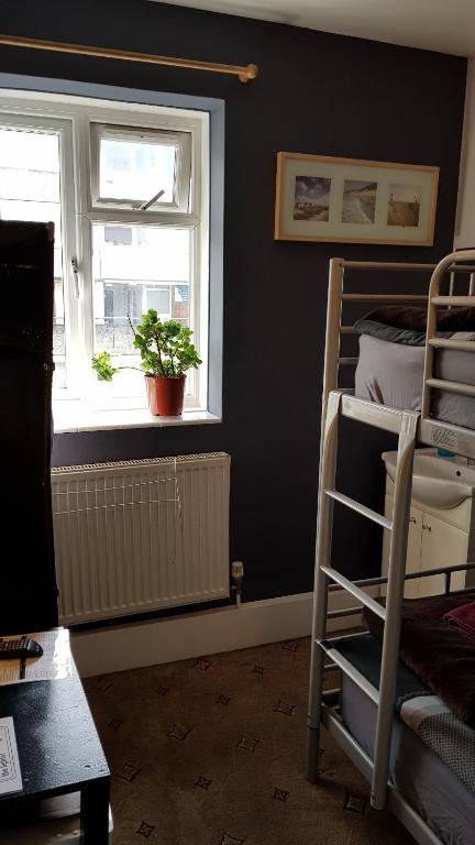 Postel nebo postele na pokoji v ubytování Hour Glass Hotel