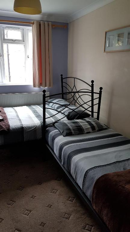 Postel nebo postele na pokoji v ubytování Hour Glass Hotel