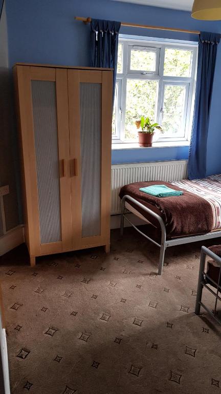 Postel nebo postele na pokoji v ubytování Hour Glass Hotel