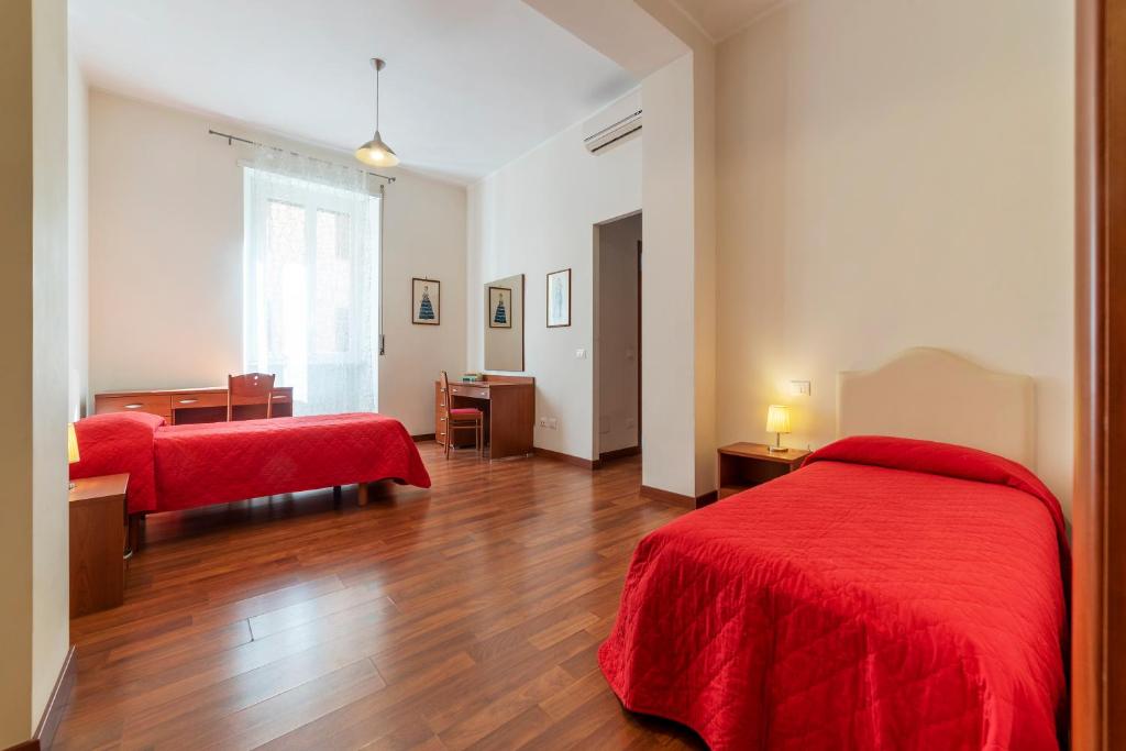 Ένα ή περισσότερα κρεβάτια σε δωμάτιο στο Piazza Re di Roma Apartment