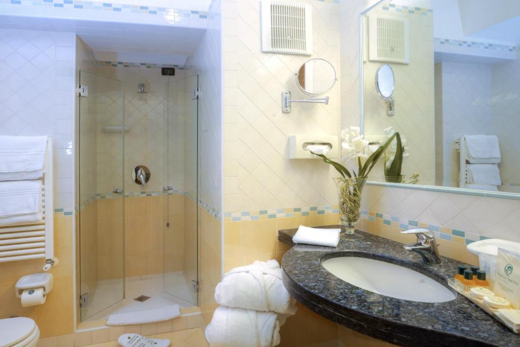 a bathroom with a sink and a shower at Le Querce Resort Sea Thermae & Spa in Ischia