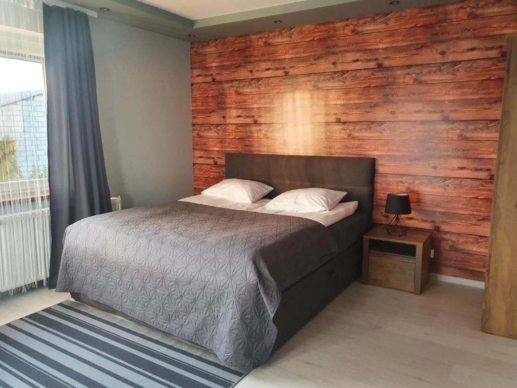 Posteľ alebo postele v izbe v ubytovaní Willa "Aparthause" E-Apartamenty