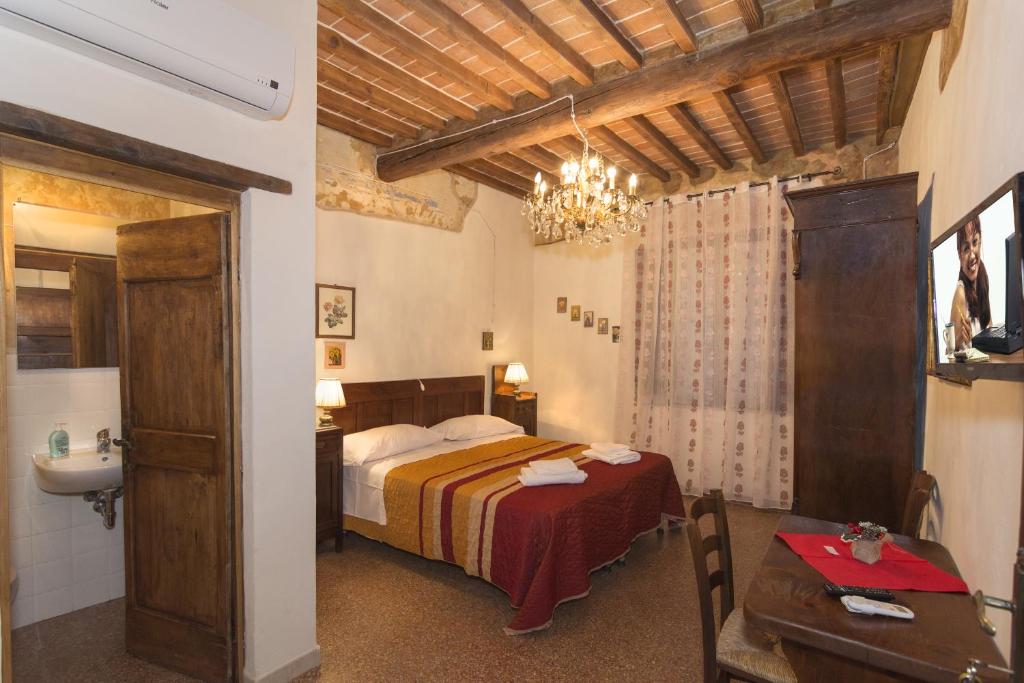 Postel nebo postele na pokoji v ubytování B&B Due Borghi