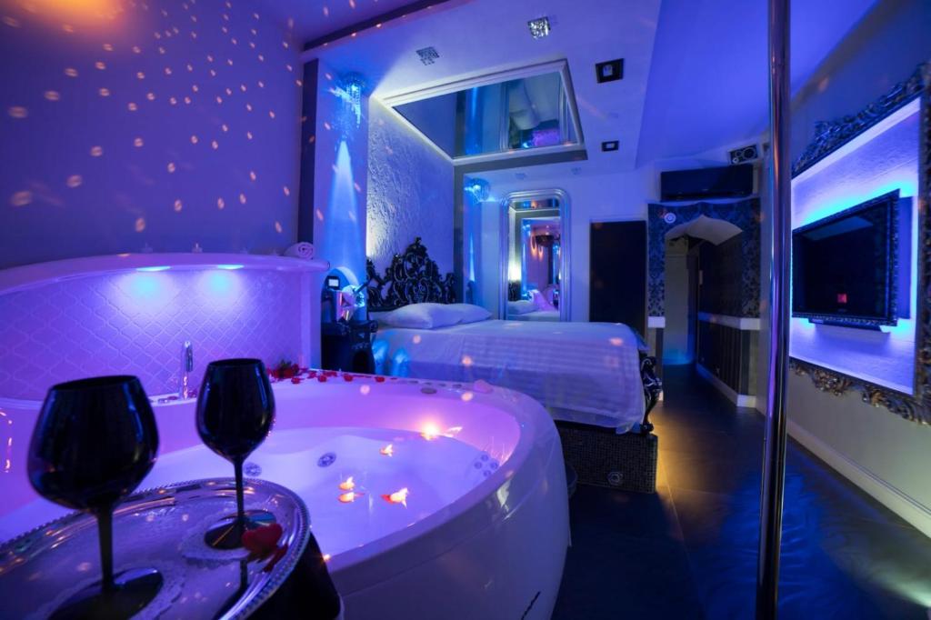 Posteľ alebo postele v izbe v ubytovaní Erossuite GuestHouse