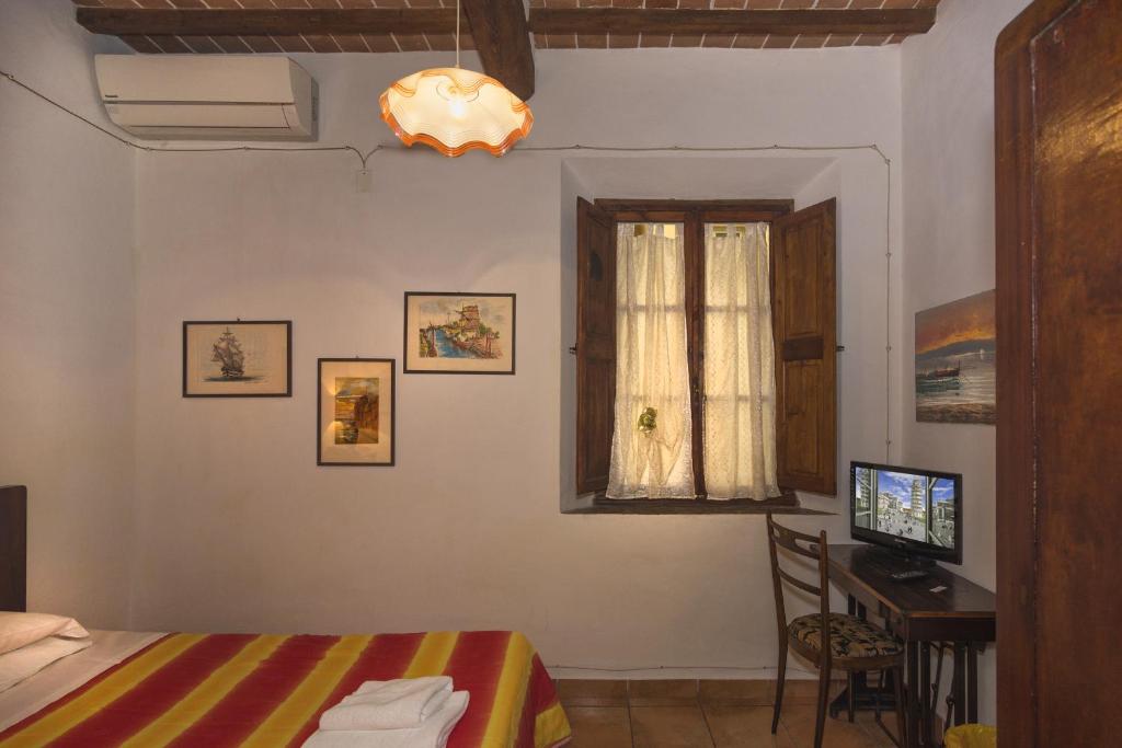 Postel nebo postele na pokoji v ubytování B&B Due Borghi