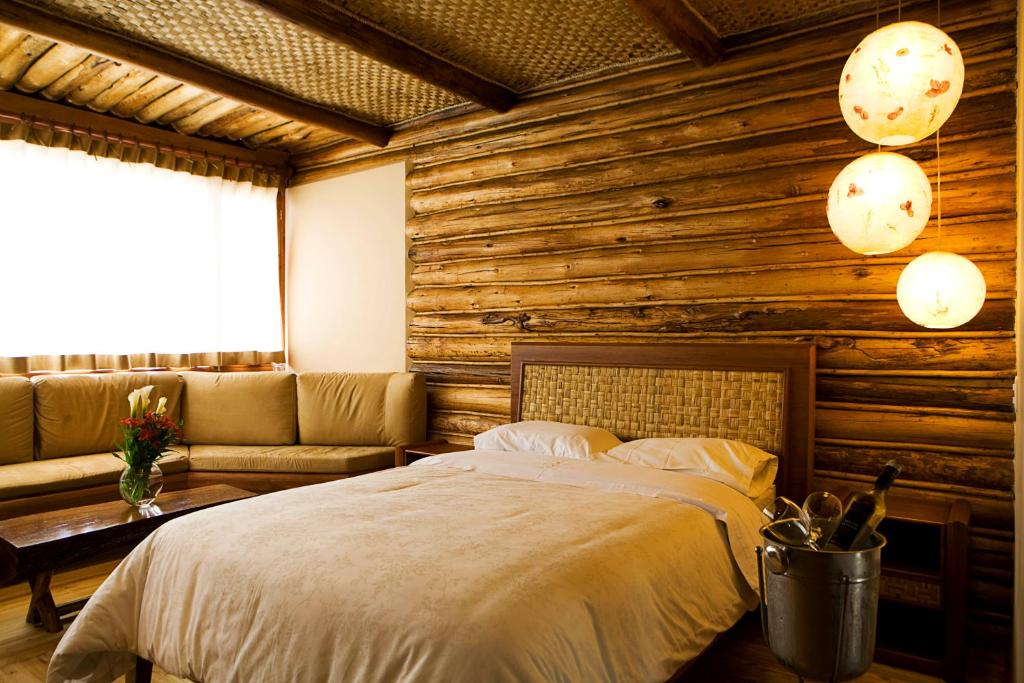 Postel nebo postele na pokoji v ubytování Hosteria Cabañas Del Lago