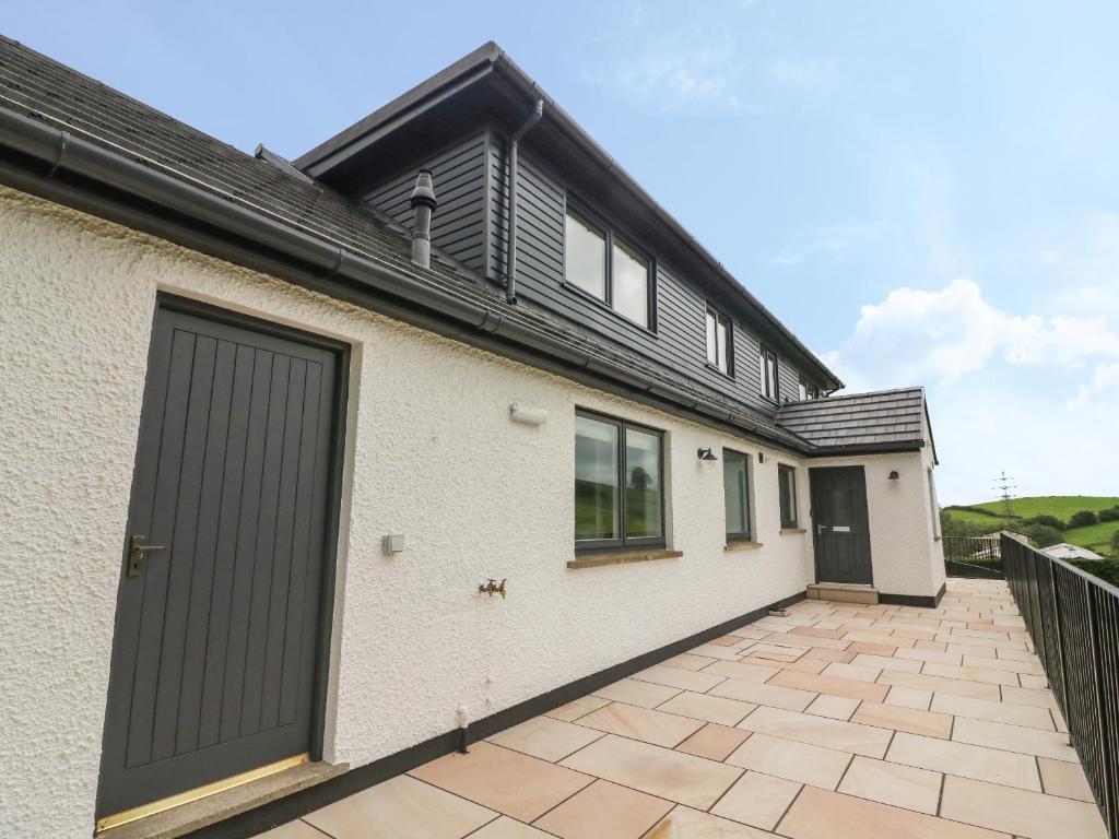 a detached house with a garage and a driveway at Beck View in Kendal