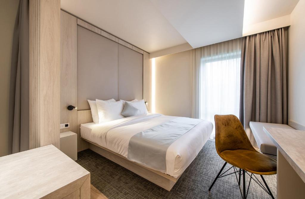 Postel nebo postele na pokoji v ubytování Begijnhof Hotel