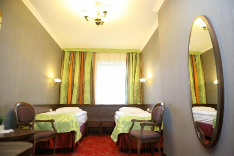 Posteľ alebo postele v izbe v ubytovaní Hotel Złoty Młyn Majków