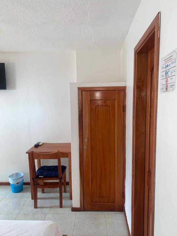 TV a/nebo společenská místnost v ubytování Hostal White House Galapagos