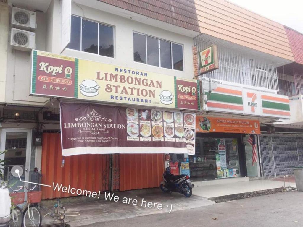 a store with signs on the front of a building at Once In Peninsula Guesthouse by Nestcove in Malacca