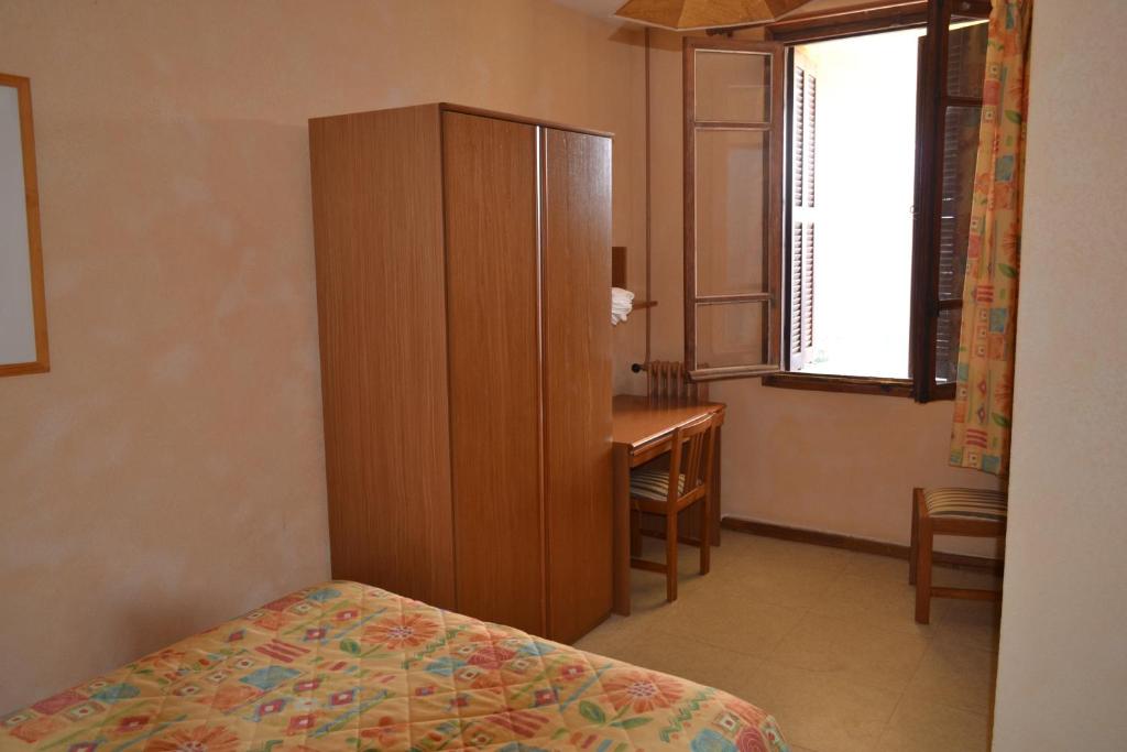 Postel nebo postele na pokoji v ubytování Hôtel Aïtone